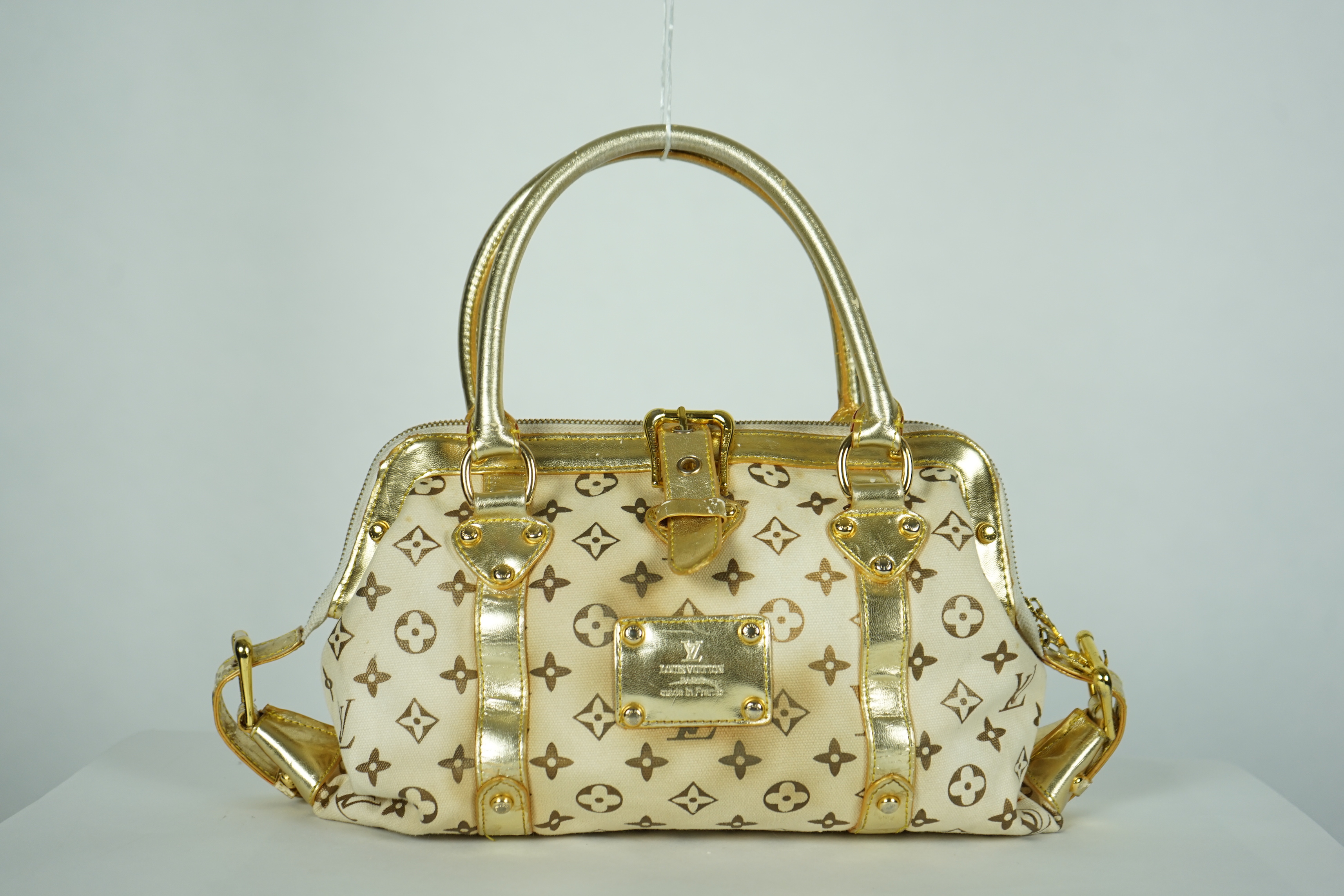 A vintage Louis Vuitton Theda beige and brown Monogram bag